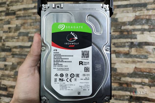 A person holding a Seagate IronWolf NAS HDD