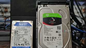 A Seagate IronWolf NAS 4TB hard drive kept next to a WD Blue 500GB hard drive