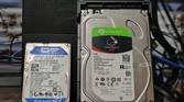 A Seagate IronWolf NAS 4TB hard drive kept next to a WD Blue 500GB hard drive
