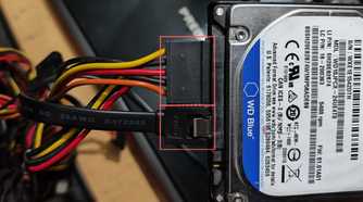 An image of SATA data and power cables plugged into a WD 500GB HDD