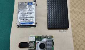 An internal HDD, external HDD, and Raspberry Pi 5 with a pen drive