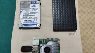 An internal HDD, external HDD, and Raspberry Pi 5 with a pen drive