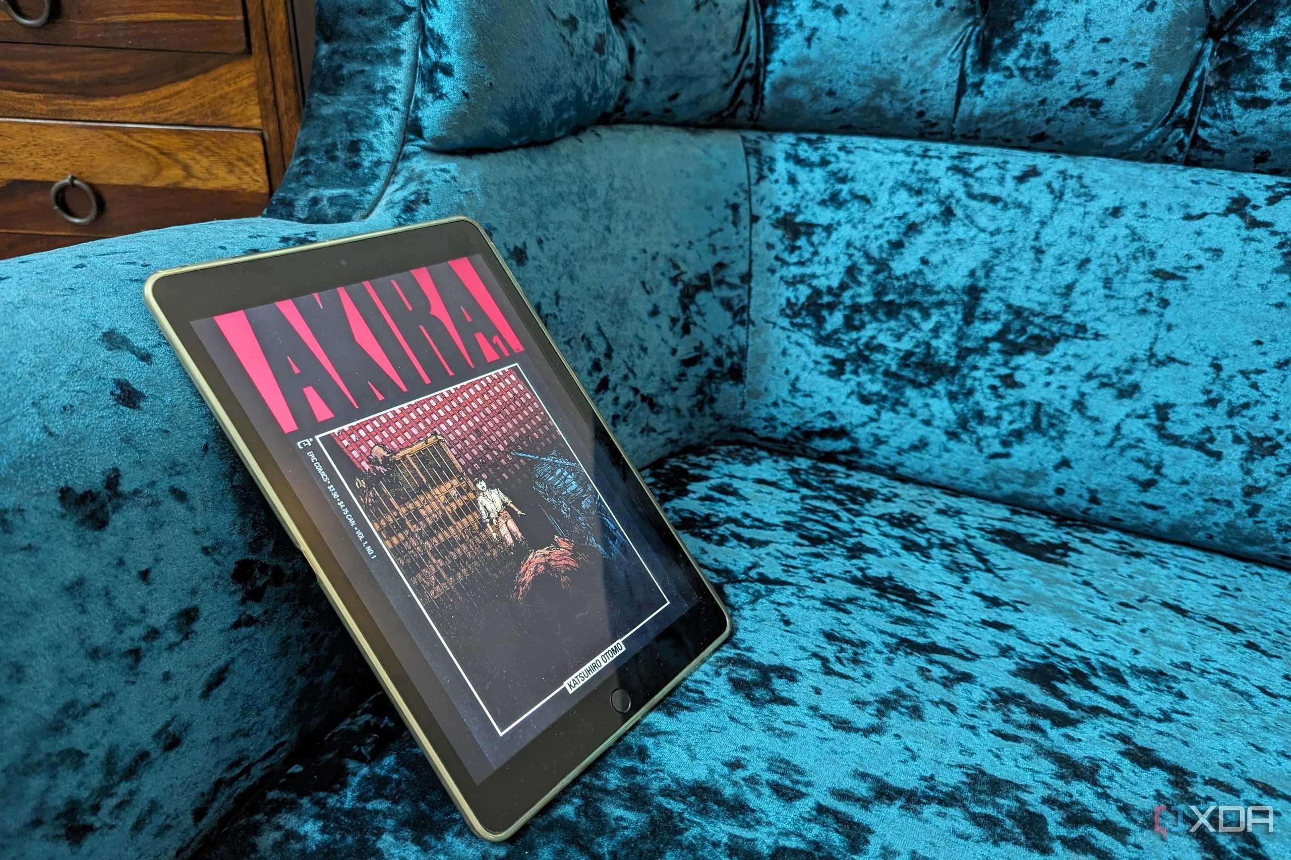 iPad 9th generation on blue sofa