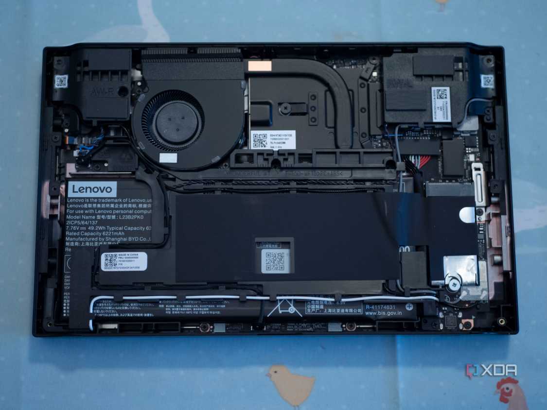 Lenovo Legion Go face down on a table with backplate removed