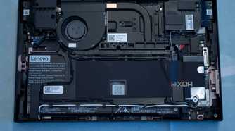 Lenovo Legion Go face down on a table with backplate removed