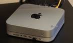 A Mac Mini with a Satechi dock connected.
