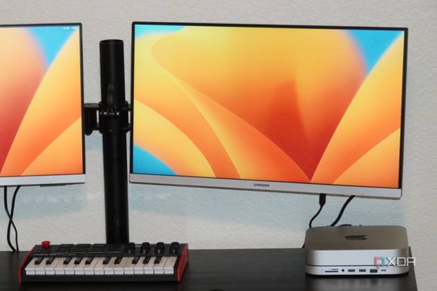 The Mac Mini on a desk with two monitors connected.