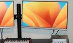 The Mac Mini on a desk with two monitors connected.
