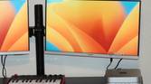 The Mac Mini on a desk with two monitors connected.