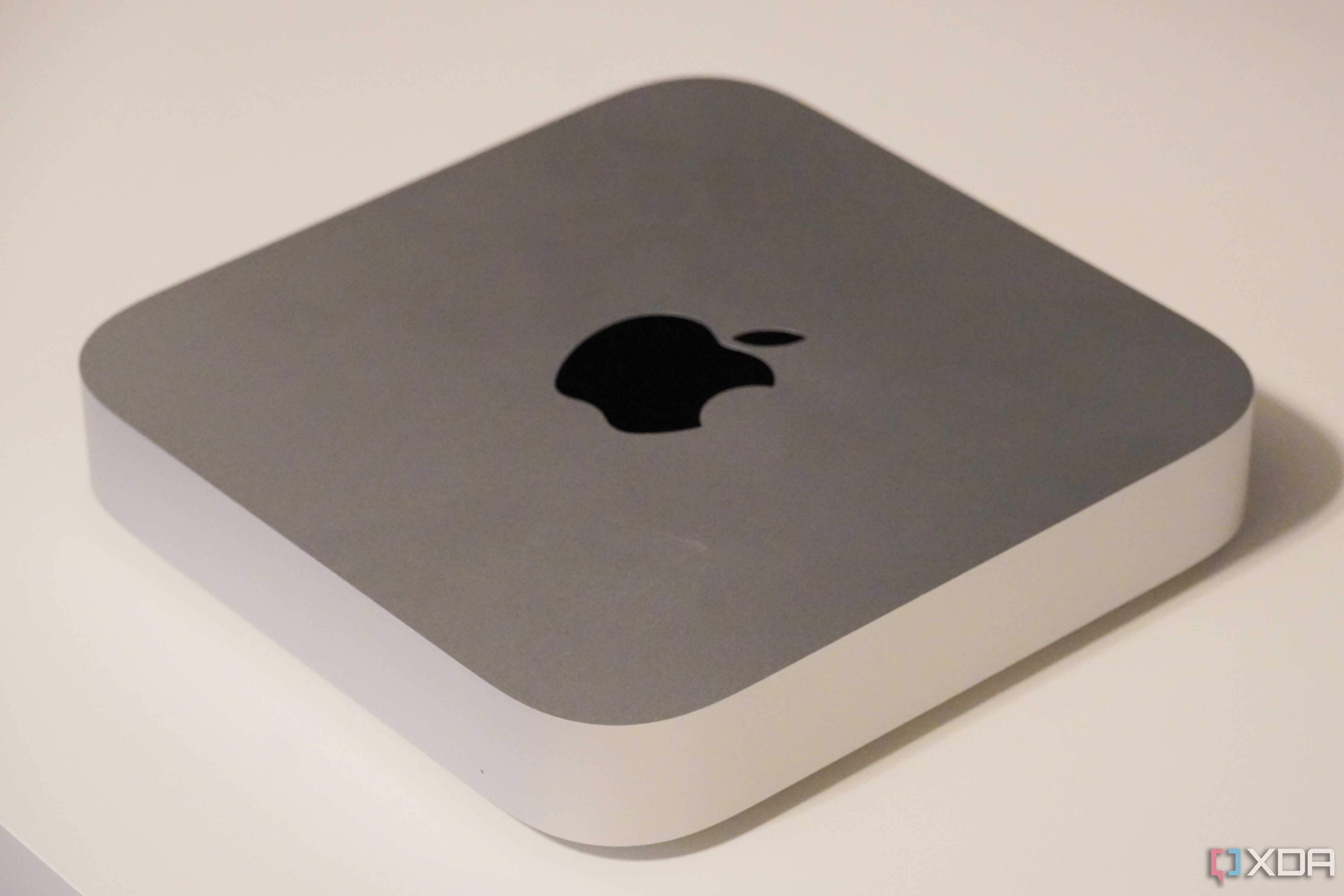 The silver Mac Mini on a desk.