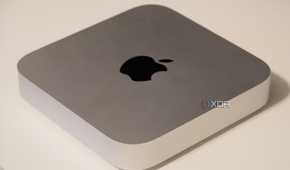 The silver Mac Mini on a desk.