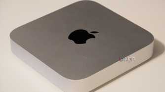 The silver Mac Mini on a desk.