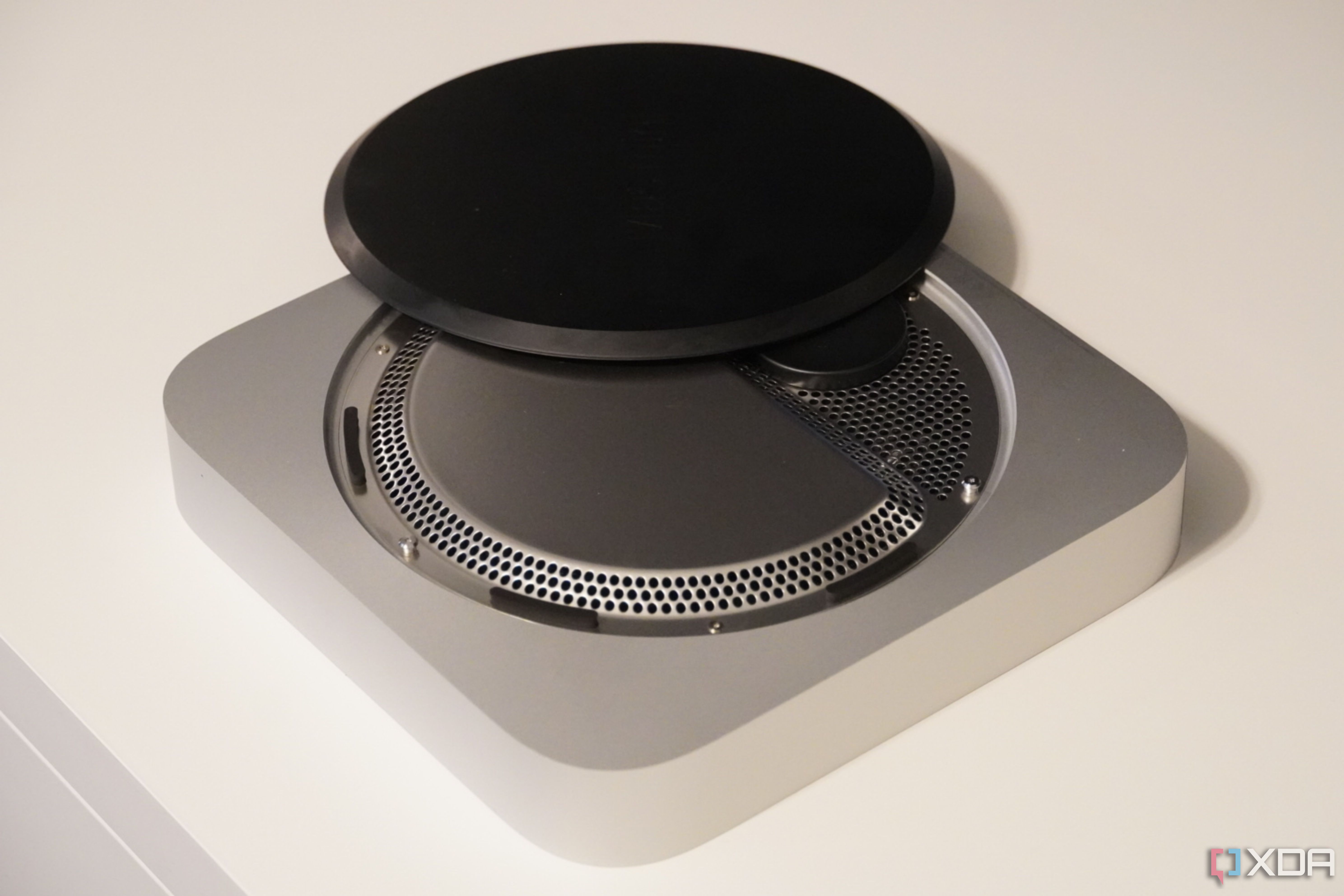 The plastic cover off of the Mac Mini.