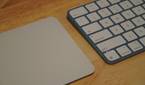 A Magic Trackpad beside a Magic Keyboard.
