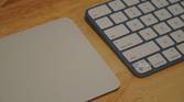 A Magic Trackpad beside a Magic Keyboard.