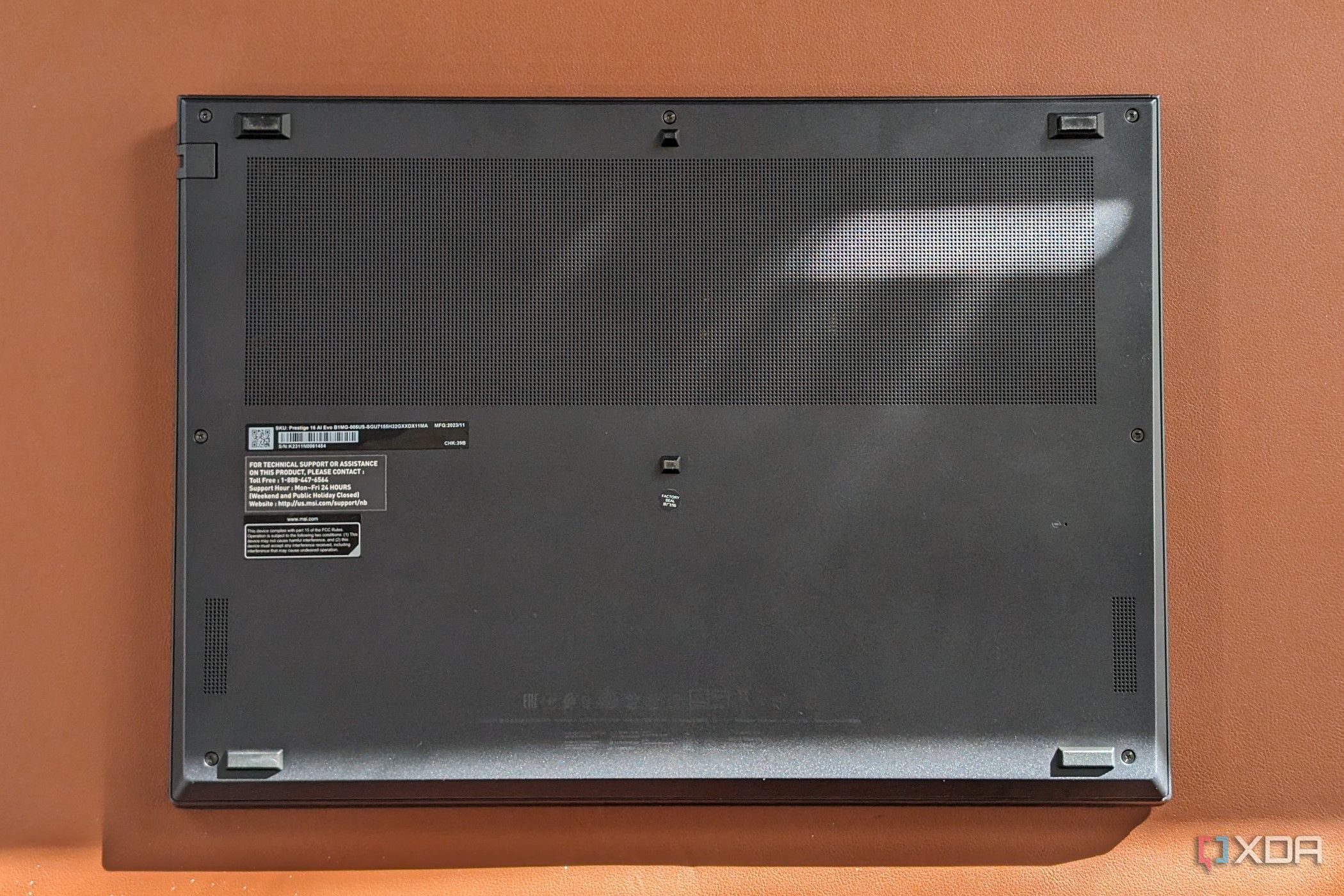 A photo of the underside of the MSI Prestige Evo 16 AI showing the bottom feet