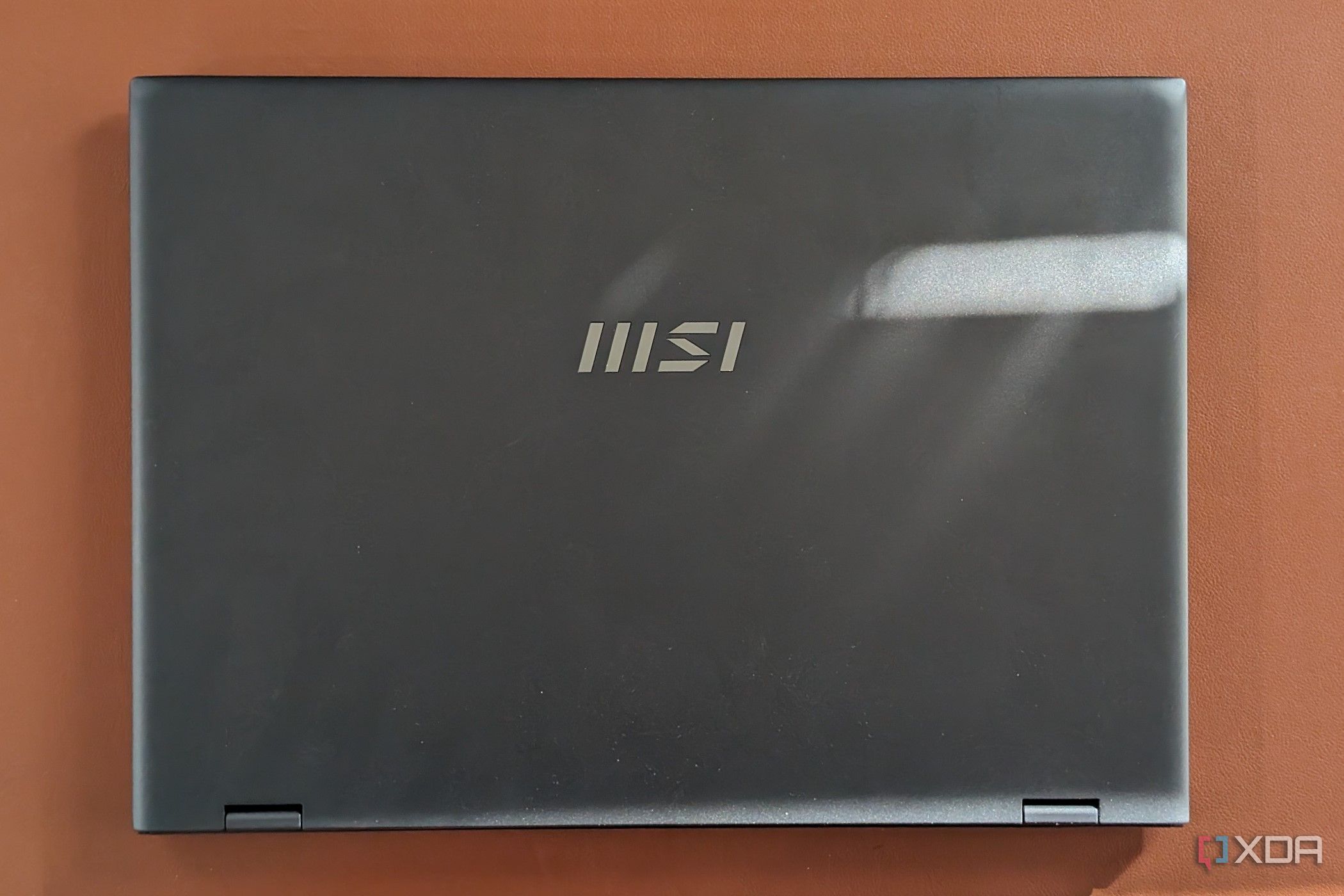 A photo of the top lid of the MSI Prestige Evo 16 AI showing the MSI logo