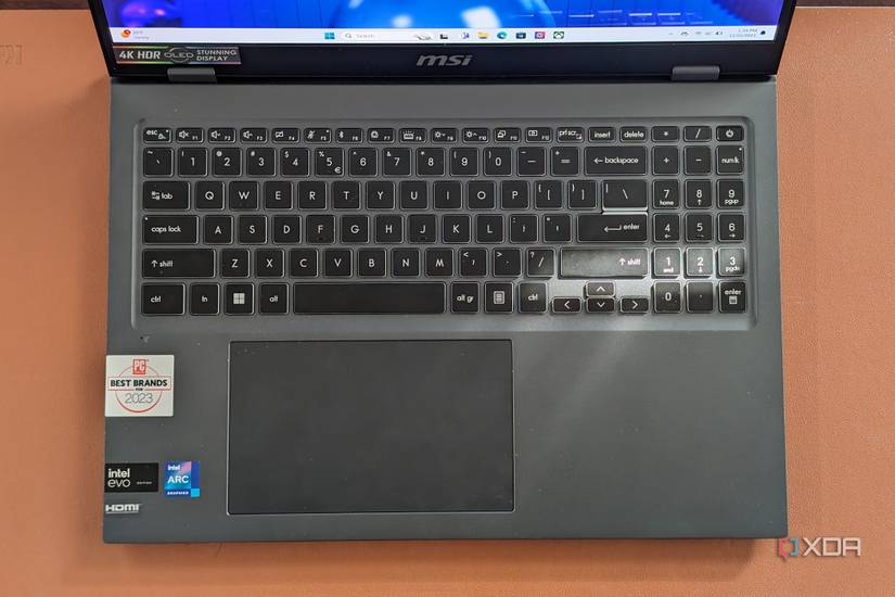 A top angled photo of the MSI Prestige Evo 16 AI showing the trackpad and the keyboard