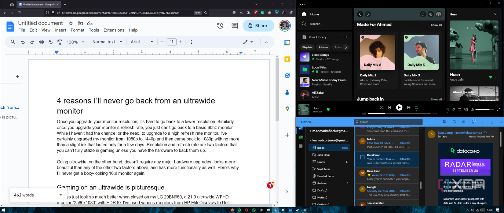 multitasking on an ultrawide monitor screenshot with browser, spotify and mail open at once