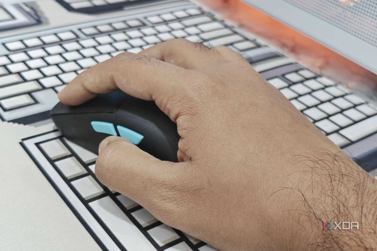 An image showing a perosn using the Harpe Ace Aim Lab Edition gaming mouse.