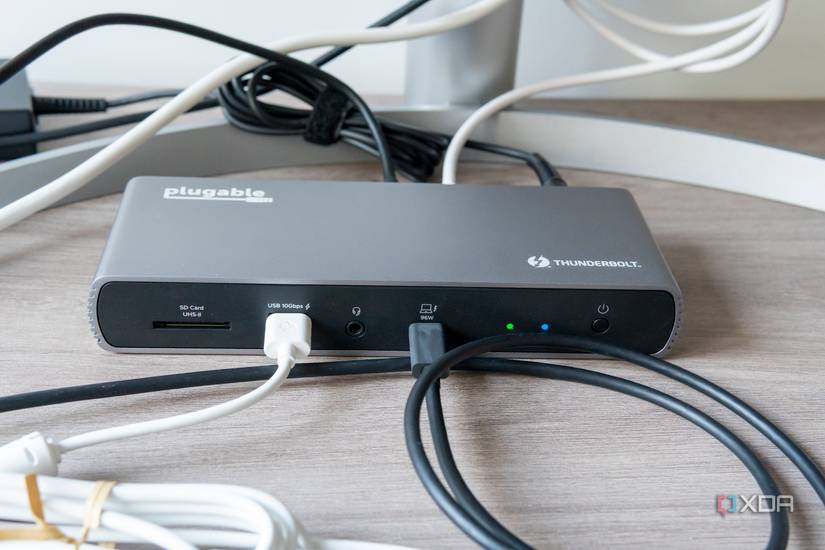 Front view of the Plugable TBT4-UDX1 with a laptop and a peripheral connected to the front ports