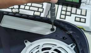 An image showing a person unscrewing the PS5 SSD slot cover.