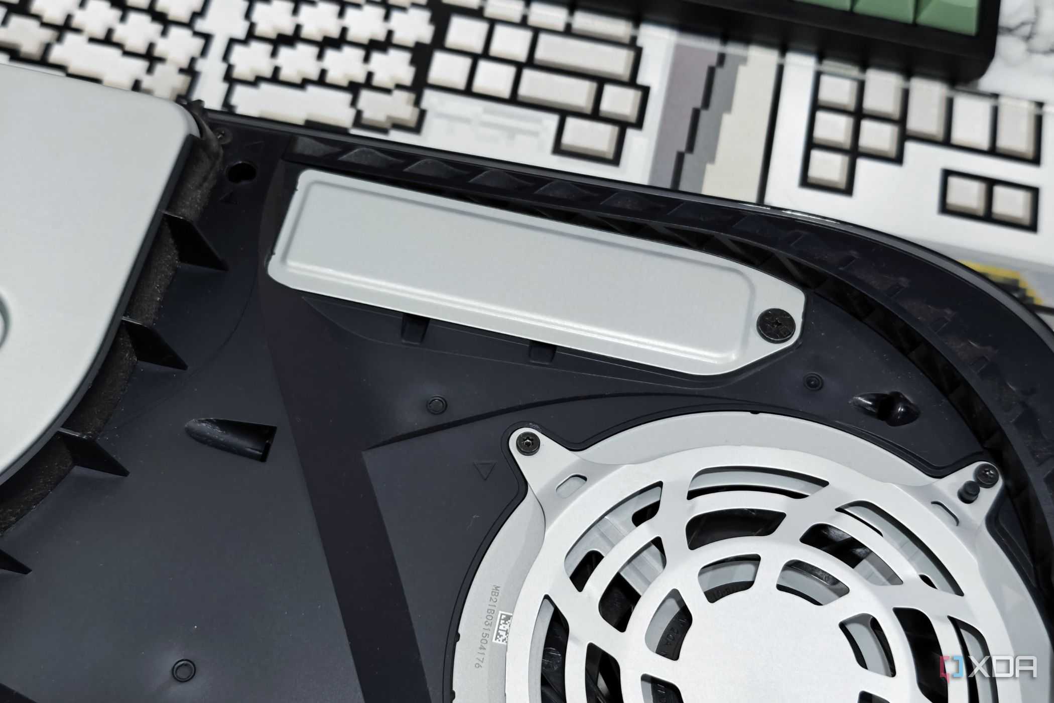 An image showing the PS5 SSD slot with a cover on it.
