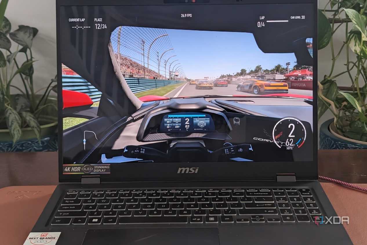 A photo of playing Forza Motorsport on the MSI Prestige 16 AI Evo laptop showing framerates at the top of the screen