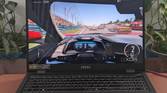 A photo of playing Forza Motorsport on the MSI Prestige 16 AI Evo laptop showing framerates at the top of the screen
