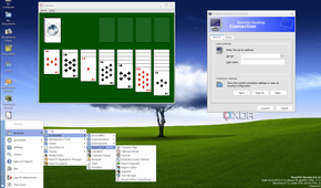 ReactOS desktop with an expanded start menu, with the RDP client and Solitaire running on background