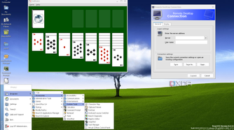 ReactOS desktop with an expanded start menu, with the RDP client and Solitaire running on background