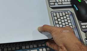 An image showing a person trying to remove PS5 side panel.