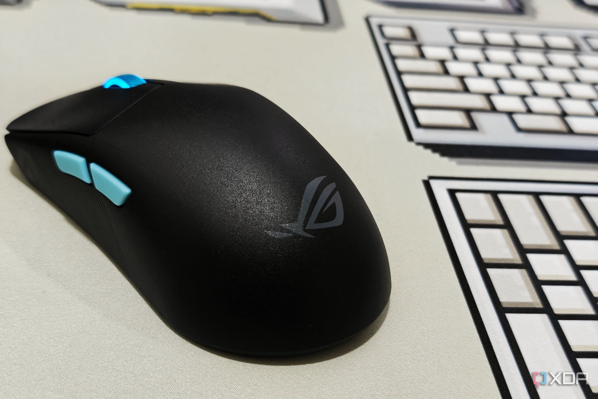 An image showing the ROG Logo on Harpe Ace Aim Lab Edition gaming mouse's palm rest area.