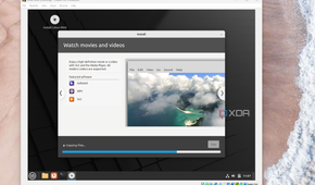 A screenshot of the Linux Mint installer showing how to watch movies and videos