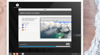 A screenshot of the Linux Mint installer showing how to watch movies and videos