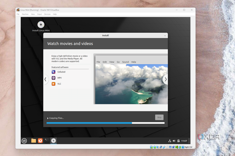 A screenshot of the Linux Mint installer showing how to watch movies and videos