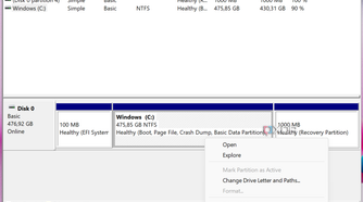Screenshot of Disk Management in Windows 11 with the option to shrink a volume