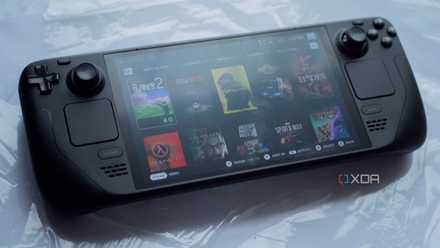 An image of a Steam Deck OLED model lying on a table showing multiple games.