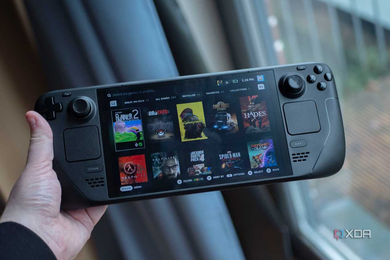 A person holding the Steam Deck OLED.