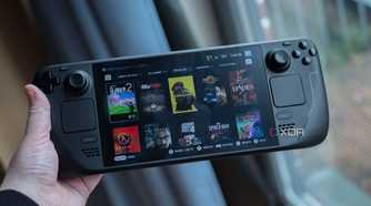 A person holding the Steam Deck OLED.