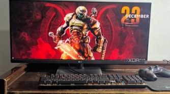 ultrawide monitor setup with doom eternal wallpaper