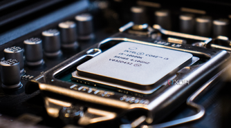 A close-up image of a CPU core i5, docked on a motherboard with the background blurred