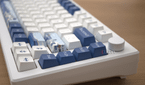 A close up image of the Akko Santorini focusing on the arrow keys and artwork keycaps