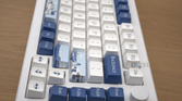 A side profile image of the Akko Santorini keyboard displaying the physical dial