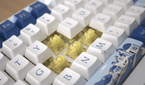 The Akko Santorini keyboard with exposed yellow switches at an angle