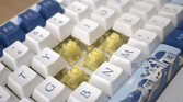The Akko Santorini keyboard with exposed yellow switches at an angle