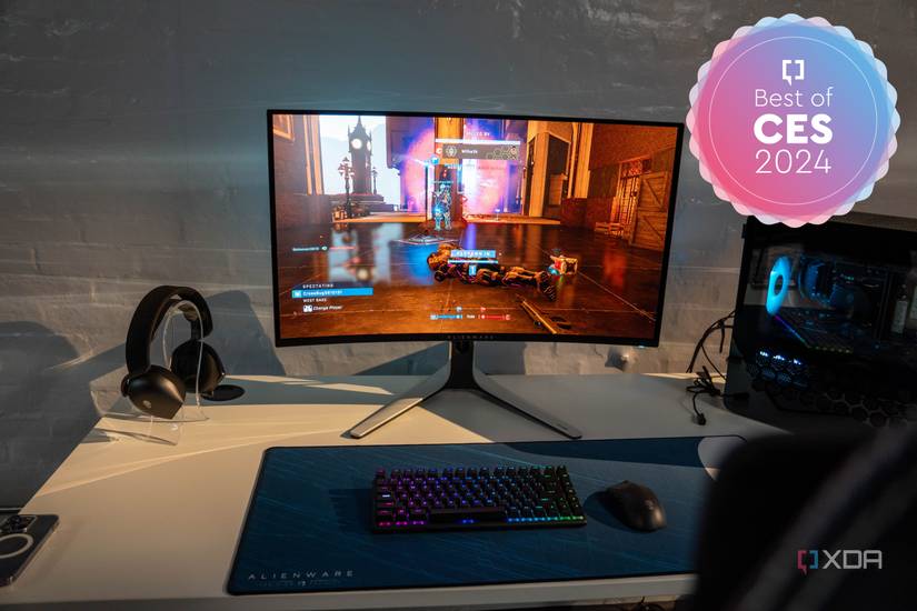 A gaming setup featuring an Alienware AW3225QF monitor.