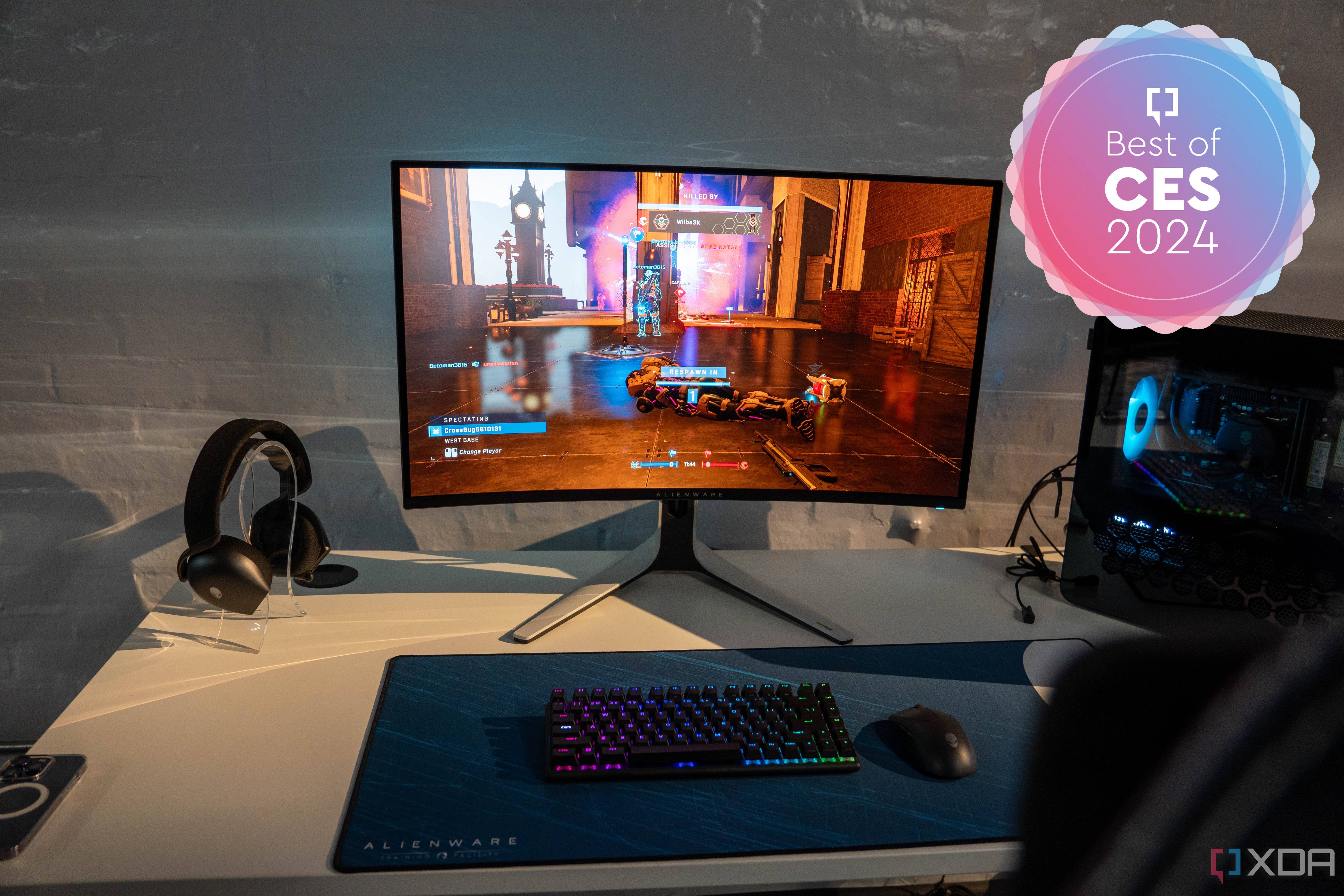 A gaming setup featuring an Alienware AW3225QF monitor.