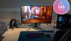 A gaming setup featuring an Alienware AW3225QF monitor.