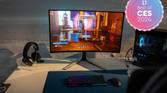 A gaming setup featuring an Alienware AW3225QF monitor.